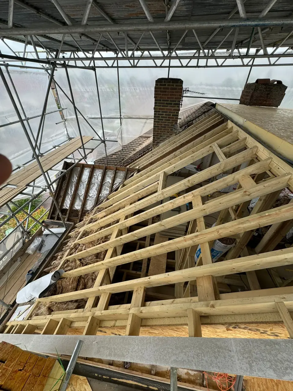 Damaged roof with broken tiles before restoration